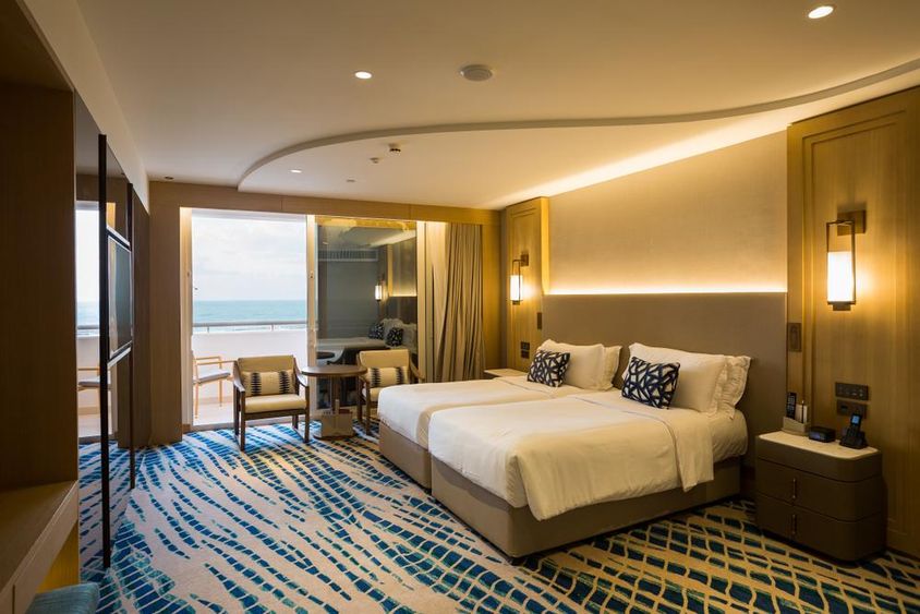 Hotel apartment room detail in Dubai, with bed and view.