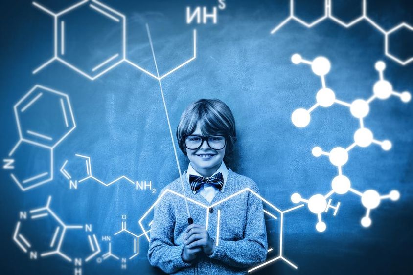 A student is shown with a projection of chemical atom bonding.