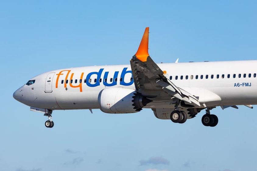Flydubai Boeing 737 MAX 8 aircraft in flight, preparing to land.