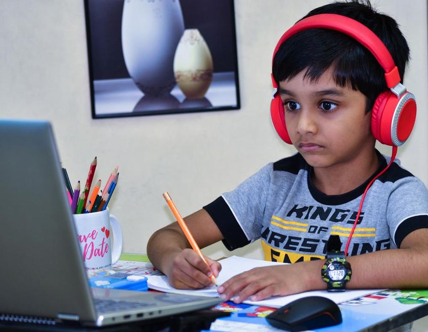 Sharjah school child writing a lesson.