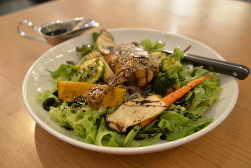 Tender duck on a salad plate.