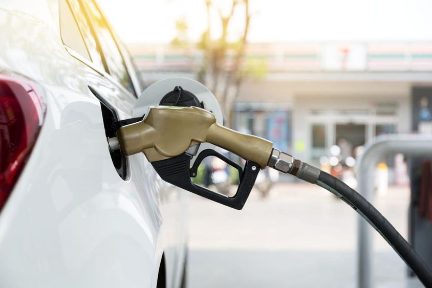Gasoline pump nozzle in a car.