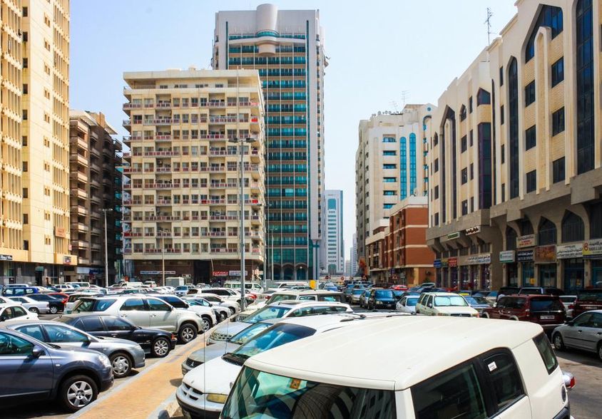 View of Abu Dhabi Skyline and parked cars in Abu Dhabi.