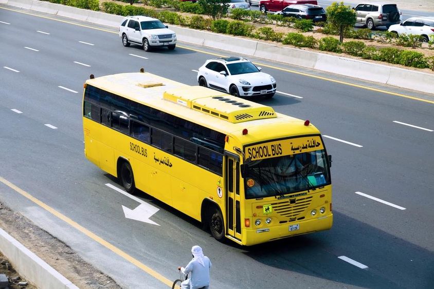 Dubai school bus on the highway.