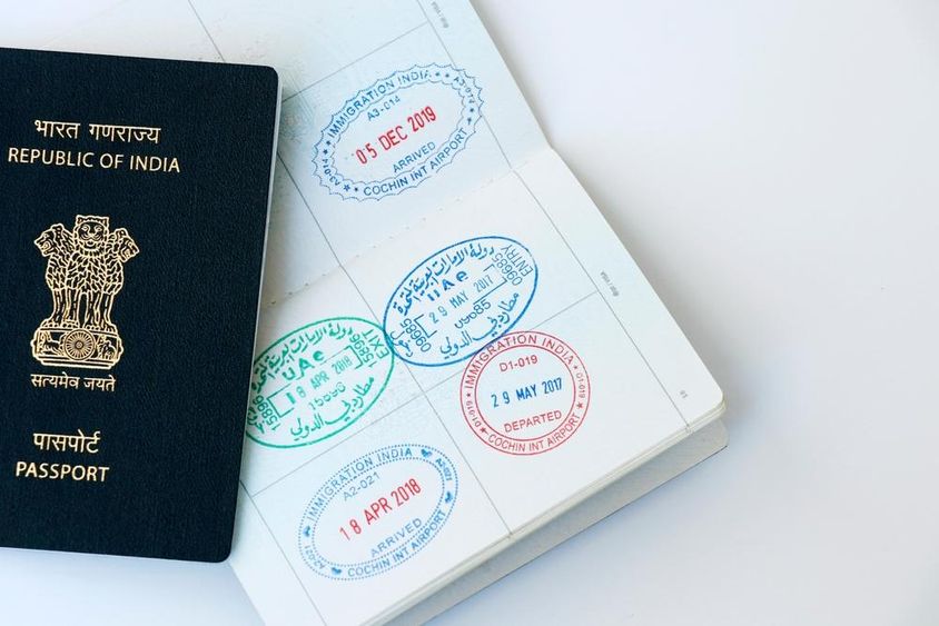United Arab Emirates and Indian official seals on passport page.