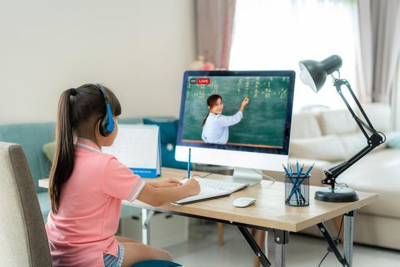 Schoolgirl learning through e-learning, utilizing online education.