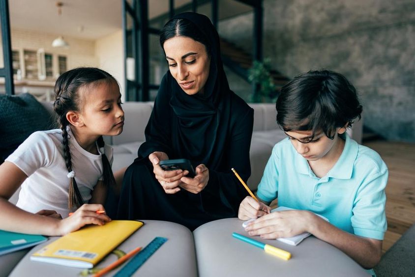 Traditional Arab family in Dubai spending time together at home.