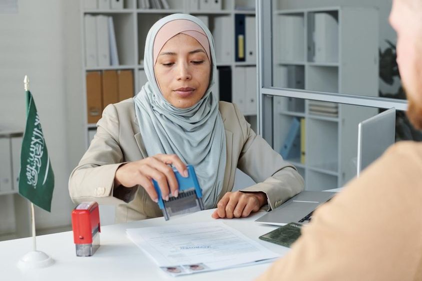 Modern consular officer stamping.