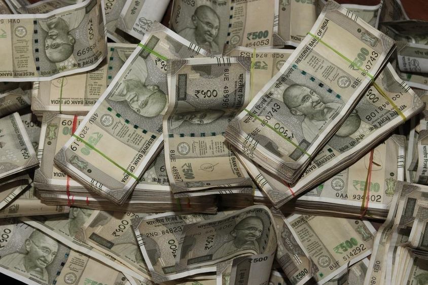 Piles of Indian currency, 500 rupee notes.