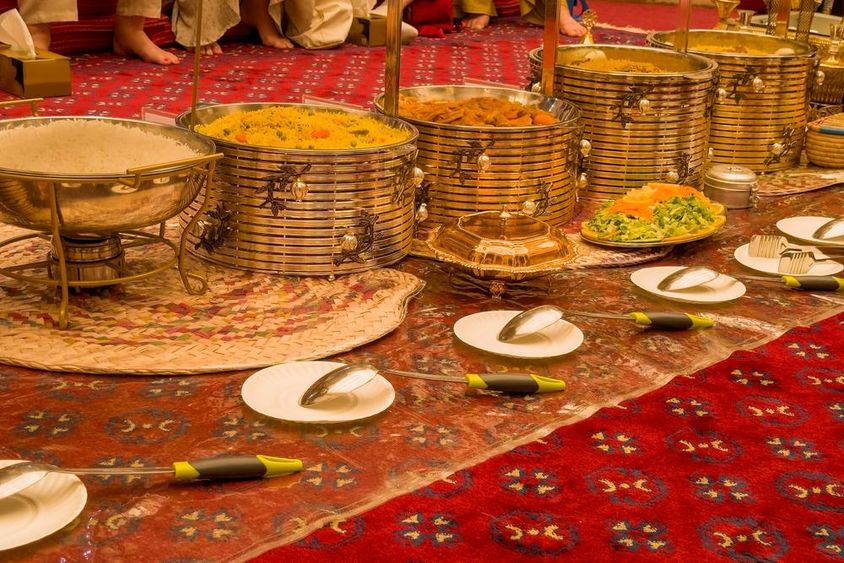View of the golden banquet table set for guests in Dubai.