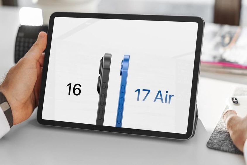 Üzletember összehasonlítja iphone 16 és iphone 17 a tableten.