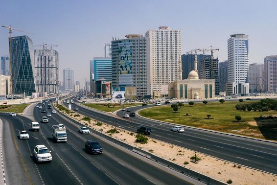View of Dubai city and highway with many cars.