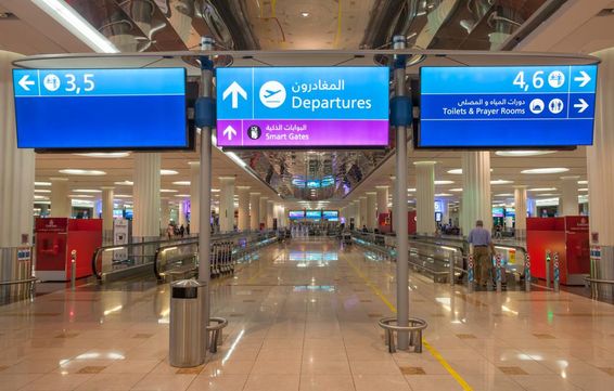 Departure sign at Dubai International Airport.