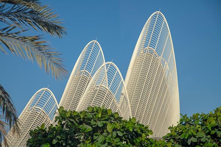 The winged towers of the Zayed National Museum under a clear blue sky.