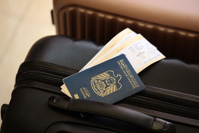 United Arab Emirates, passport with tickets in the airport terminal.