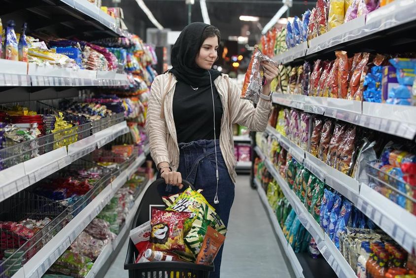 A young Arab woman in a supermarket
