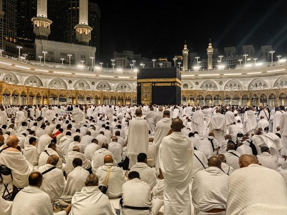Nighttime pilgrims gather around the Kaaba