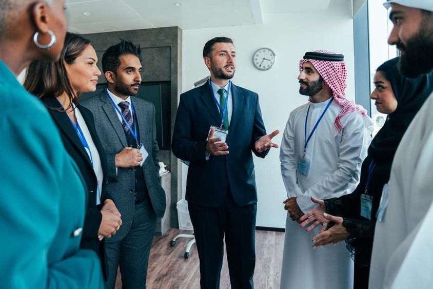 Multinational businesspeople standing in an office